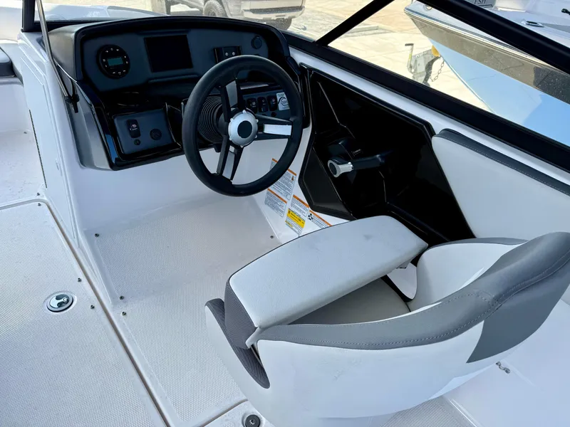Slide: The Image of 2025 Yamaha Boats AR190 cockpit with steering wheel and control panel. - 11