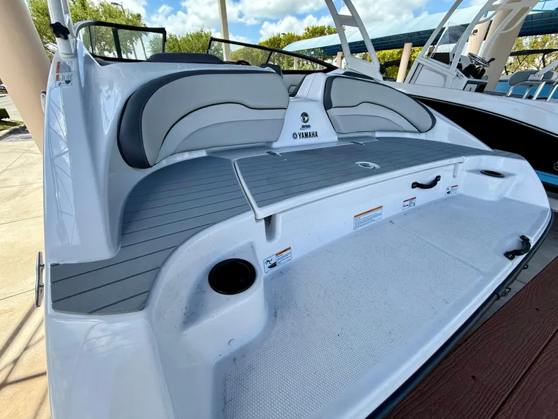 Slide: The Image of 2025 Yamaha Boats AR190, sleek design, spacious seating, modern features, outdoor setting. - 5