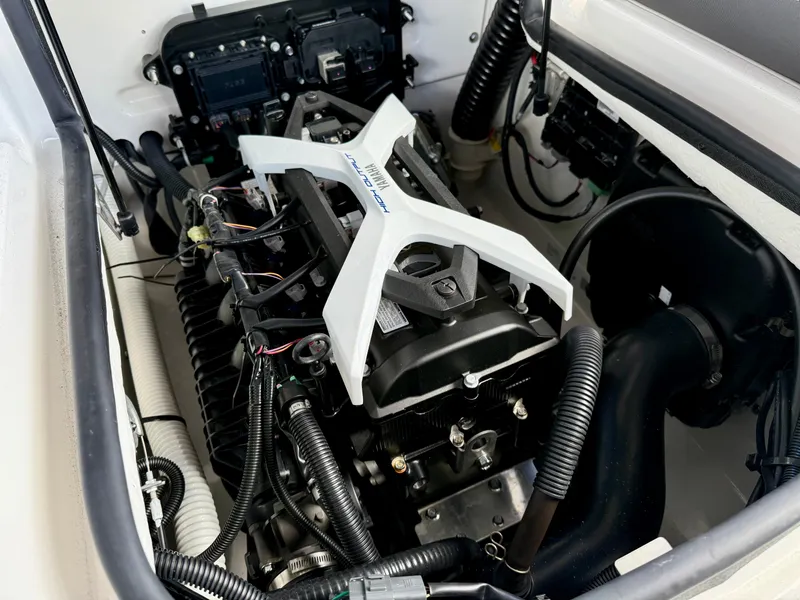 Slide: The Image of Engine compartment of a 2025 Yamaha Boats AR190, showcasing intricate mechanical components. - 8