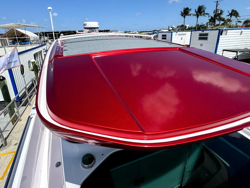 Slide: The Image of Red roof of 2023 Axopar 37 XC CROSS CABIN boat at marina. - 8