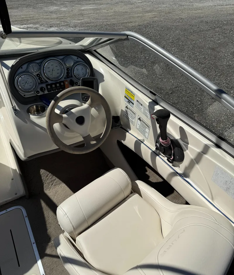 Slide: The Image of 2006 Azure AZ188 boat interior with steering wheel and control panel. - 10