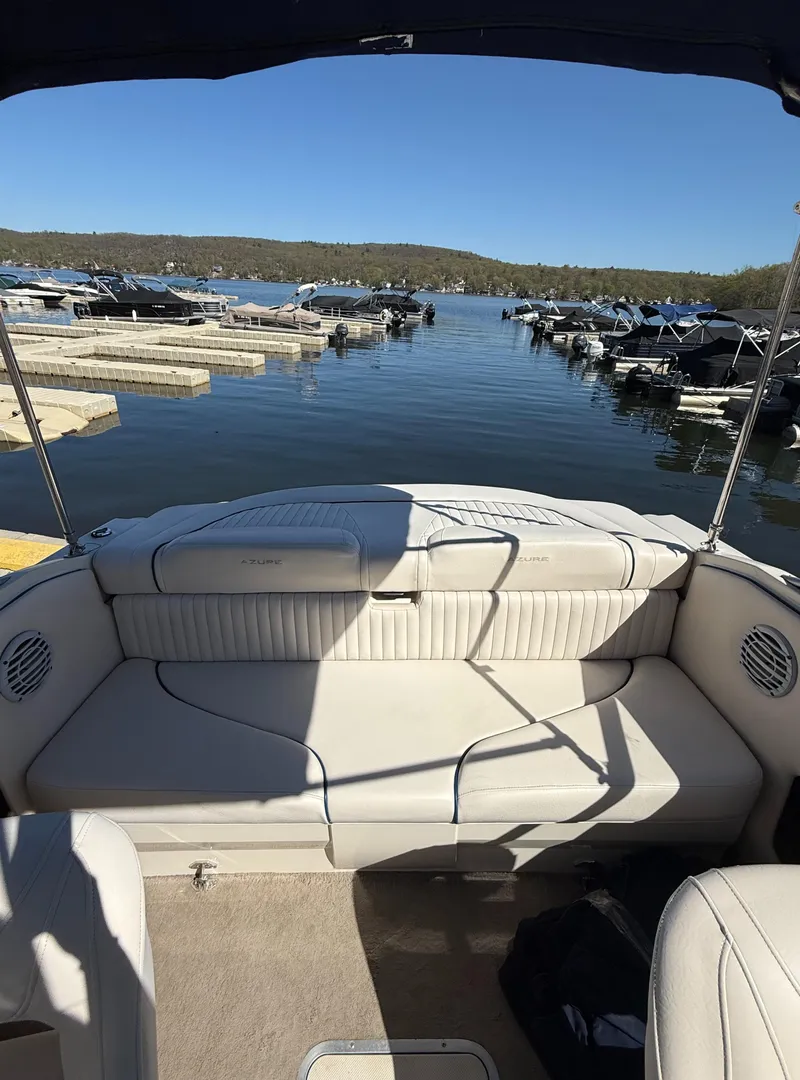 Slide: The Image of 2006 Azure AZ188 boat interior with lake view and docked boats. - 12