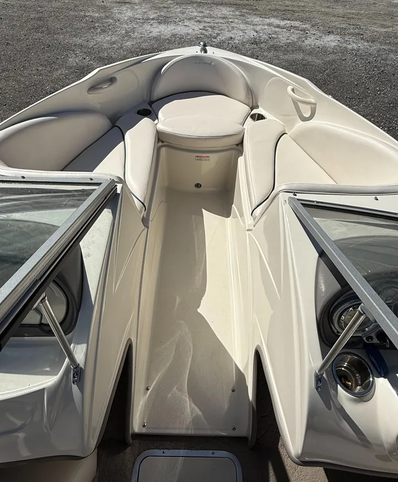 Slide: The Image of 2006 Azure AZ188 boat interior with white seating and open windshield. - 6