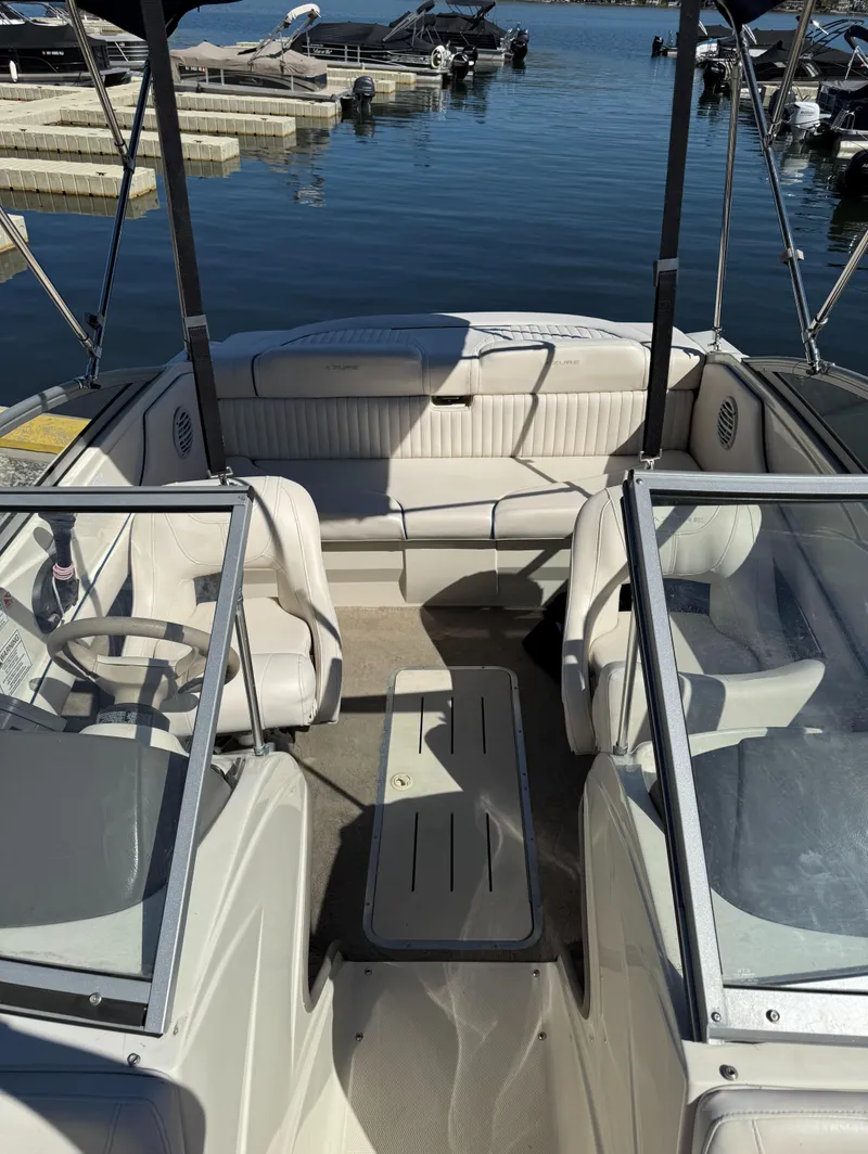 Slide: The Image of 2006 Azure AZ188 boat interior with seating, docked at marina. - 7