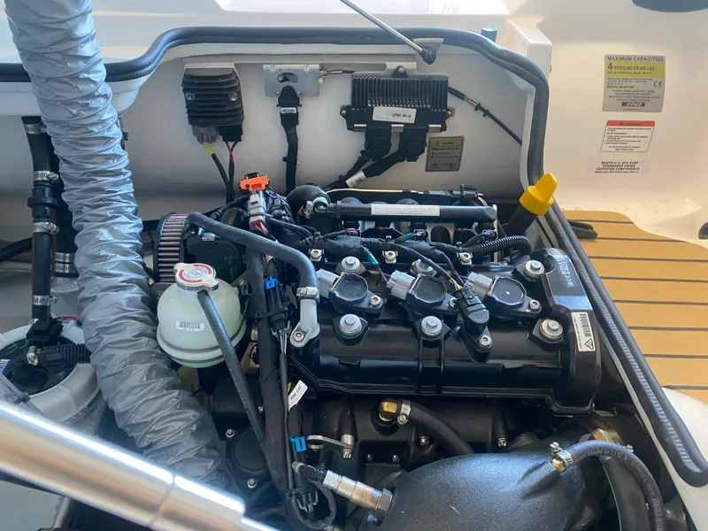 Slide: The Image of Engine compartment of 2024 AB Inflatables ABJET 290, showcasing detailed mechanical components. - 11