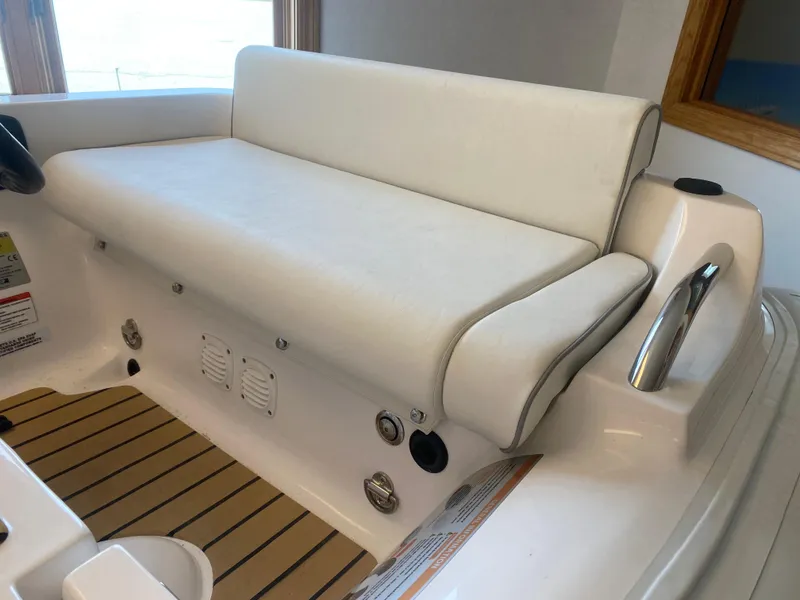 Slide: The Image of 2024 AB Inflatables ABJET 290 boat interior with white seating and wooden flooring. - 4