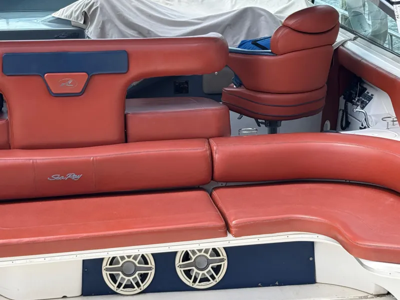 Slide: The Image of Red leather seating on a 1999 Sea Ray Sundancer 50 yacht, featuring built-in speakers. - 16