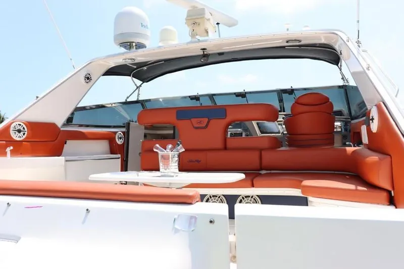 Slide: The Image of 1999 Sea Ray Sundancer 50 yacht interior with orange seating and modern amenities. - 2