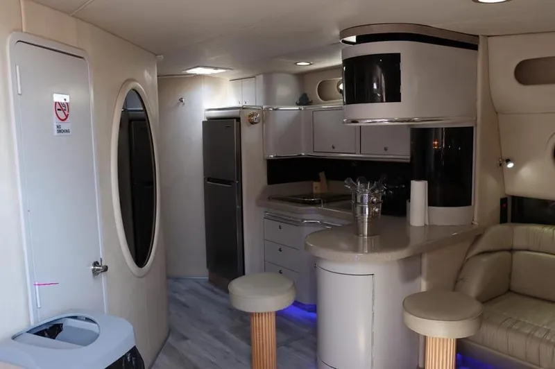 Slide: The Image of Interior of 1999 Sea Ray Sundancer 50 yacht with modern kitchen and seating area. - 23