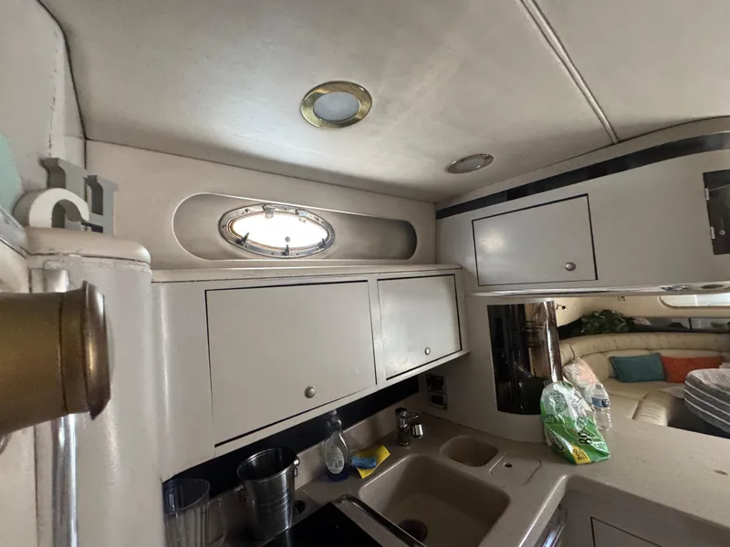 Slide: The Image of 1999 Sea Ray Sundancer 50 yacht interior kitchen with cabinets and sink. - 30