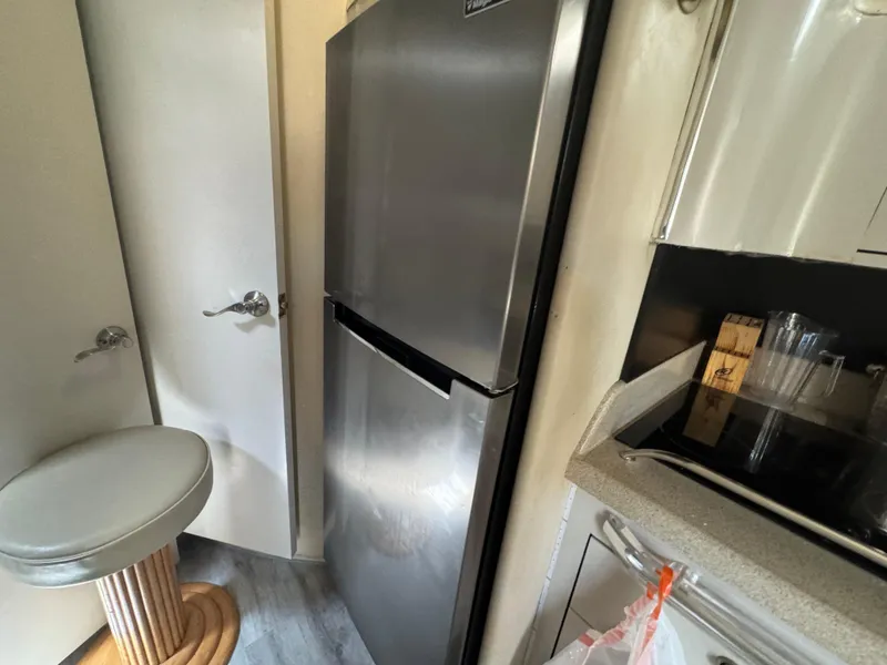 Slide: The Image of Interior of 1999 Sea Ray Sundancer 50 yacht kitchen with stainless steel fridge. - 40