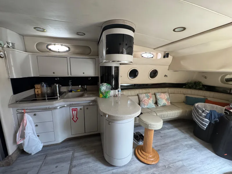 Slide: The Image of Interior of a 1999 Sea Ray Sundancer 50 yacht with kitchen and seating area. - 43