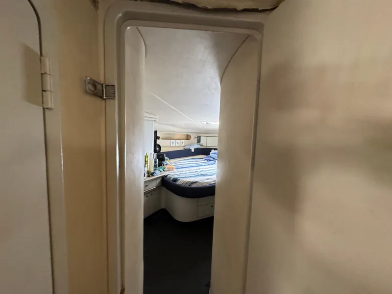 Slide: The Image of Interior cabin view of 1999 Sea Ray Sundancer 50 yacht, featuring a cozy bedroom. - 44