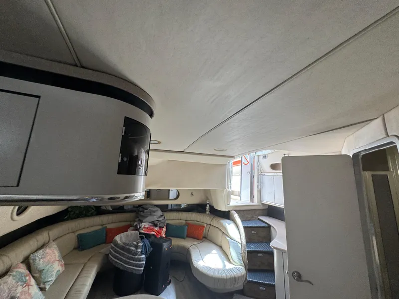 Slide: The Image of Interior of a 1999 Sea Ray Sundancer 50 yacht with curved seating and modern design. - 48