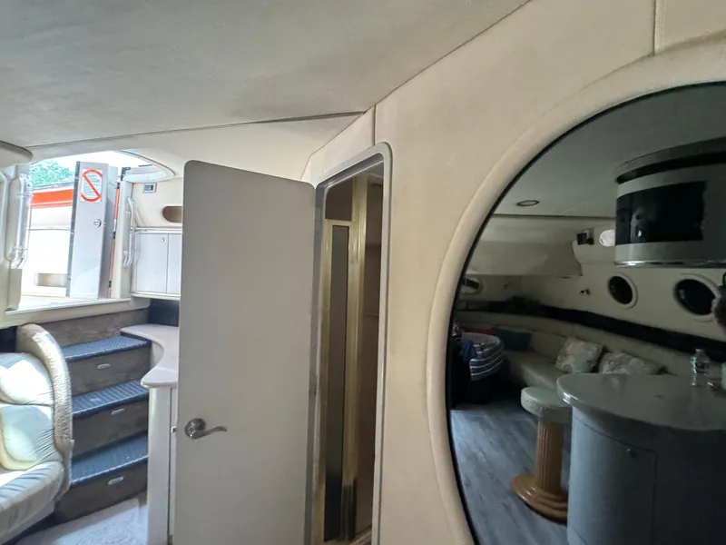 Slide: The Image of Interior of 1999 Sea Ray Sundancer 50 yacht, featuring cozy seating and modern amenities. - 49