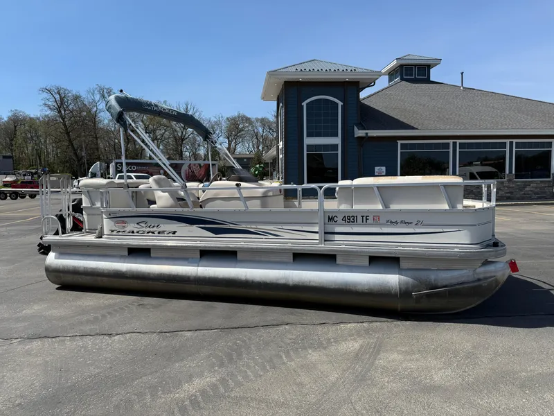 The Image of 2005 Sun Tracker Party Barge 21 pontoon boat parked outside a building. - 1