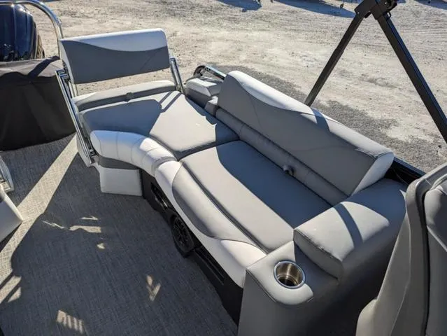 Slide: The Image of 2025 Avalon LSZ QUAD LOUNGE SWITCH 2385 interior with gray seating and cup holder. - 12