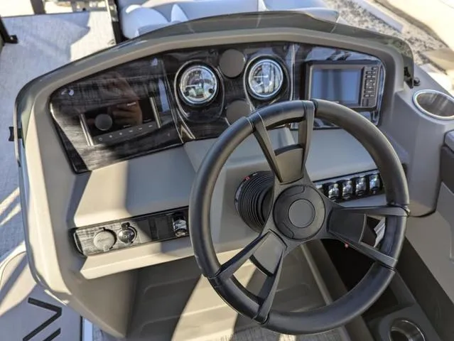 Slide: The Image of Steering console of 2025 Avalon LSZ Quad Lounge Switch 2385, featuring modern gauges and controls. - 14