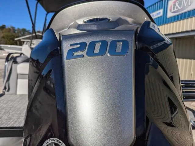 Slide: The Image of Close-up of a 200 horsepower engine on a 2025 Avalon LSZ QUAD LOUNGE SWITCH 2385. - 7