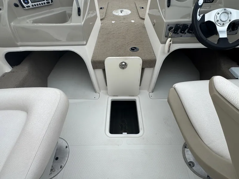 Slide: The Image of Interior of a 2011 FinCraft 1850 boat showing seating and storage compartments. - 15