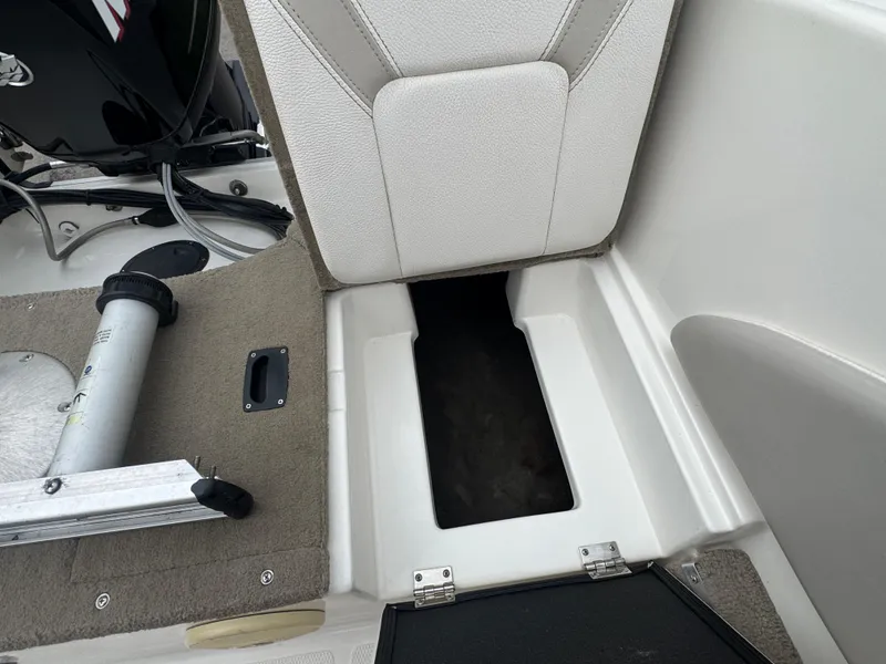 Slide: The Image of Open storage compartment in a 2011 FinCraft 1850 boat interior. - 19