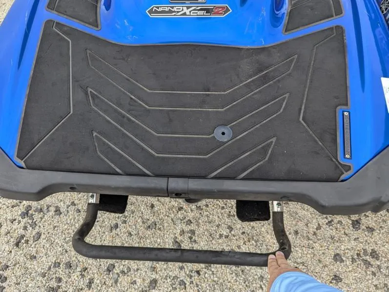 Slide: The Image of 2022 Yamaha WaveRunner EX LIMITED GP 1800, blue with black footrest, on textured surface. - 10