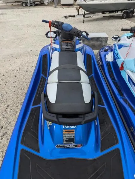 Slide: The Image of 2022 Yamaha WaveRunner EX LIMITED GP 1800, blue and black, parked on sandy ground. - 13