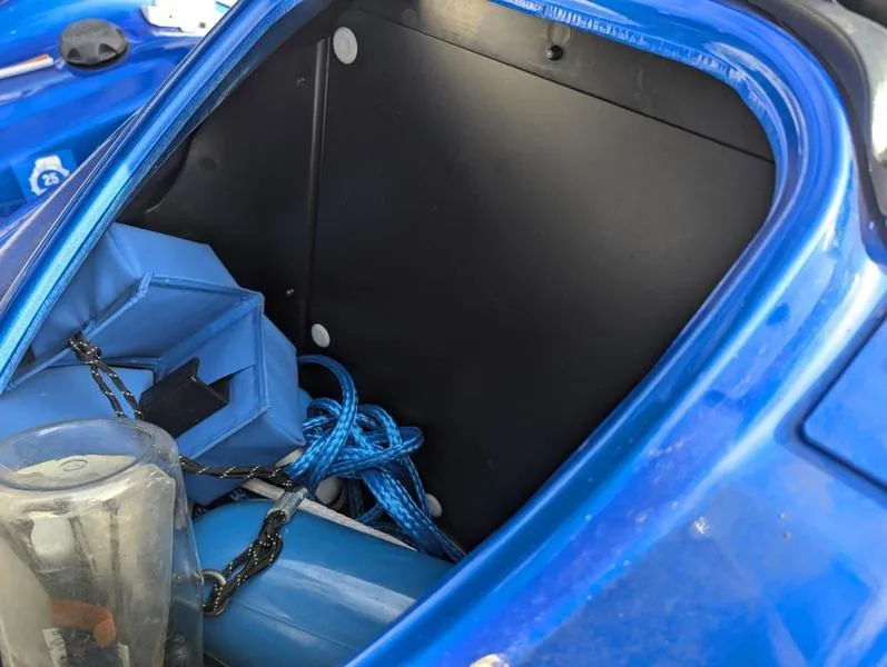 Slide: The Image of Storage compartment of 2022 Yamaha WaveRunner EX LIMITED GP 1800 with blue accessories. - 14