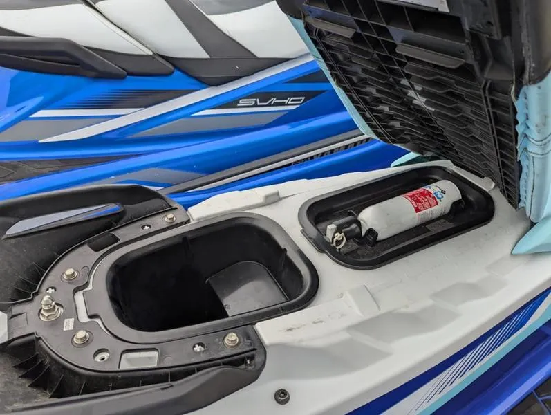 Slide: The Image of 2022 Yamaha WaveRunner EX LIMITED GP 1800 storage compartment with fire extinguisher, blue and white design. - 6