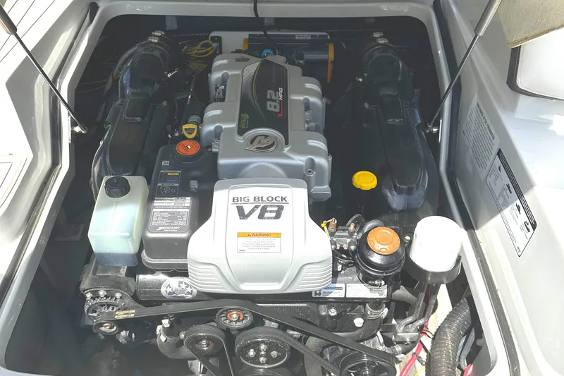 Slide: The Image of 2020 Crownline 290 SS boat with built-in grill and sink on deck. - 30