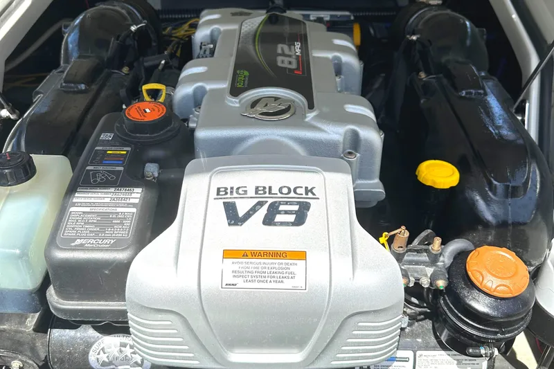 Slide: The Image of 2020 Crownline 290 SS boat on trailer, covered and parked outdoors. - 34