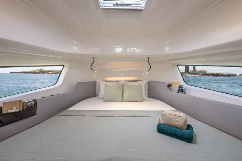 Slide: The Image of Luxurious interior of 2025 Delphia D10 Sedan yacht with cozy bed and ocean view. - 14