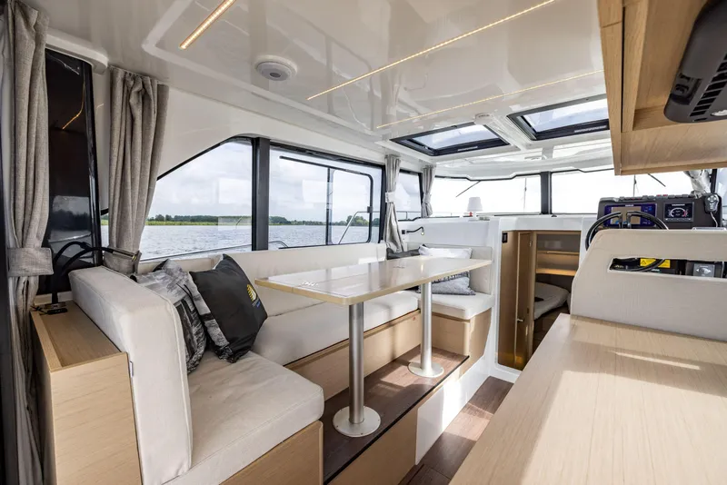 Slide: The Image of Interior of 2025 Delphia D10 Sedan, featuring modern seating and panoramic windows. - 8