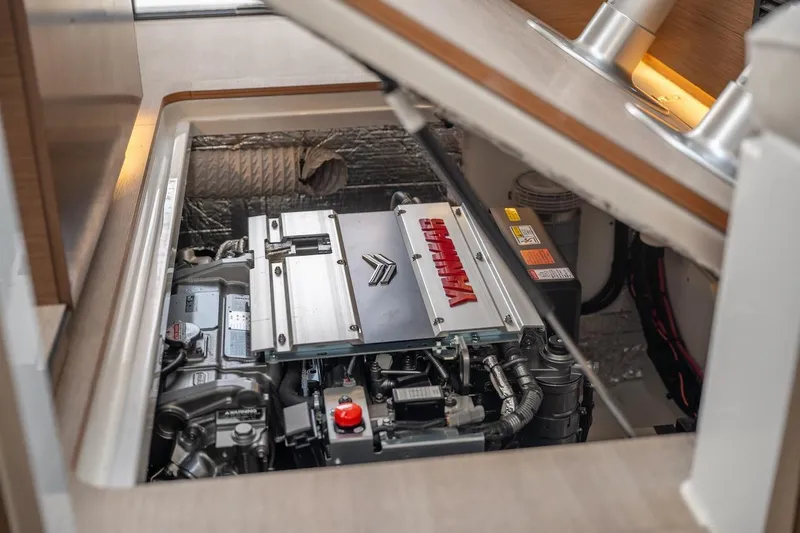 Slide: The Image of Engine compartment of 2025 Delphia D11 SEDAN boat, showcasing mechanical components. - 38