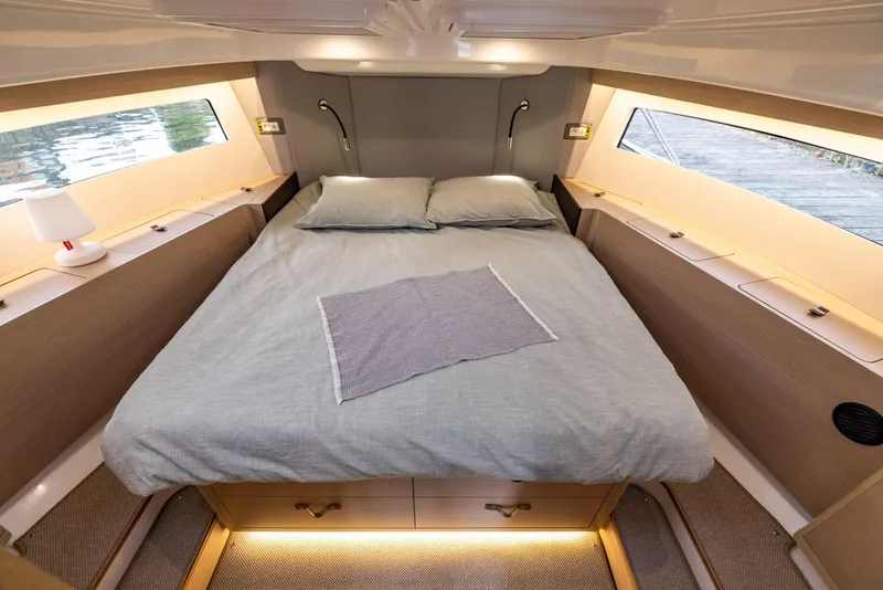 Slide: The Image of Luxurious cabin interior of 2025 Delphia D11 SEDAN with cozy bed and ambient lighting. - 7