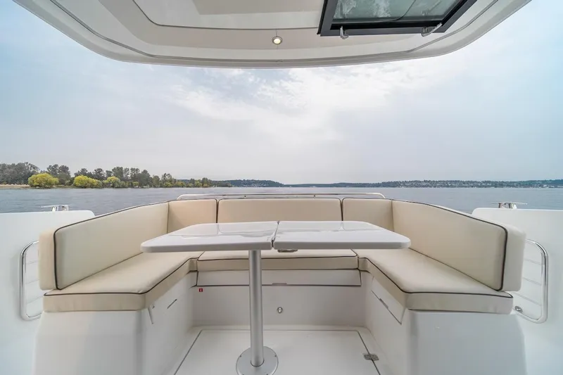 Slide: The Image of Luxurious seating area on 2025 Delphia D11 SEDAN yacht with scenic water view. - 9