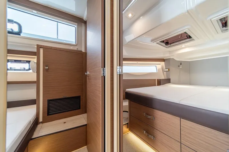 Slide: The Image of Luxurious interior of 2025 Delphia D11 SEDAN yacht with modern wood finishes. - 26