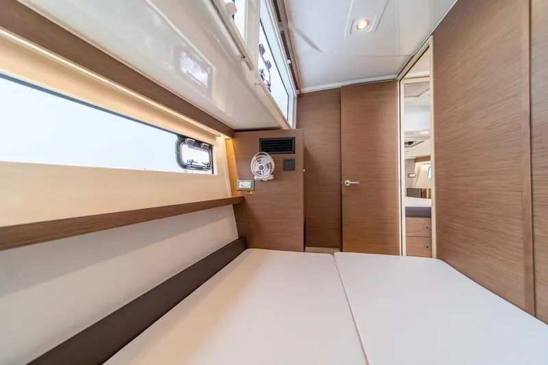Slide: The Image of Interior cabin of 2025 Delphia D11 SEDAN yacht, featuring modern wood paneling and sleek design. - 27