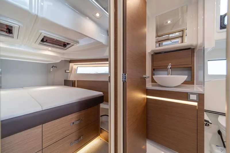 Slide: The Image of Luxurious interior of 2025 Delphia D11 SEDAN yacht with modern bedroom and bathroom. - 28