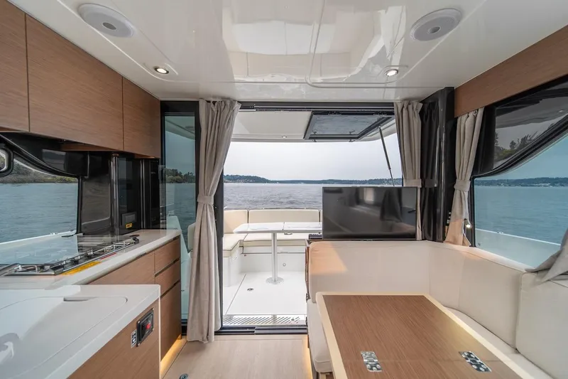 Slide: The Image of Luxurious interior of 2025 Delphia D11 SEDAN yacht with scenic water view. - 25