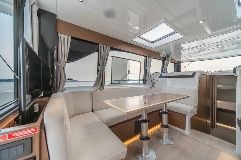 Slide: The Image of Interior of 2025 Delphia D11 SEDAN yacht with elegant seating and dining area. - 33