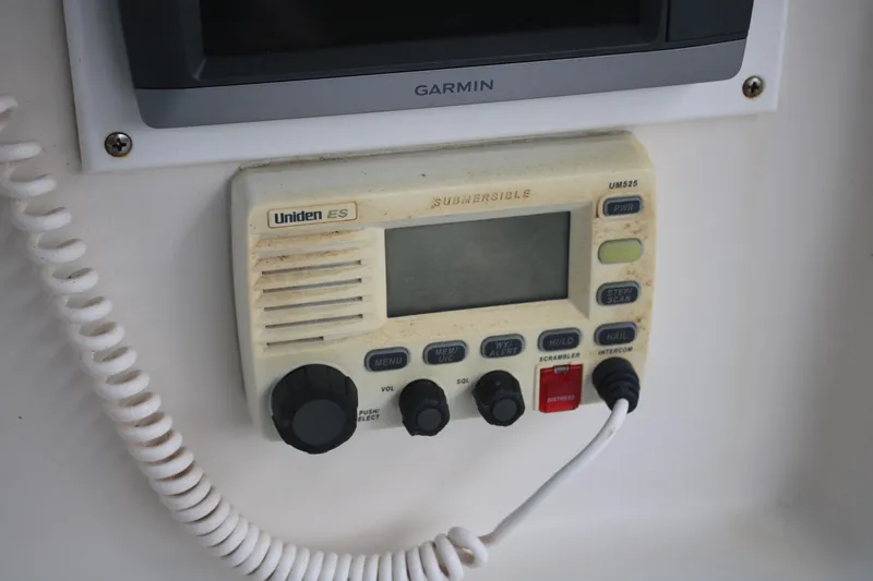 Slide: The Image of Uniden ES marine radio on 2006 Seaswirl Striper 2601 boat dashboard. - 21