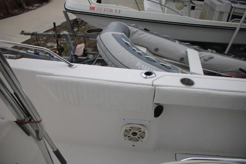 Slide: The Image of 2006 Seaswirl Striper 2601 boat interior with inflatable dinghy and speaker. - 23