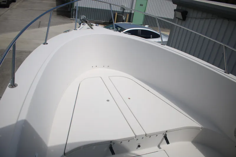 Slide: The Image of 2006 Seaswirl Striper 2601 boat deck with storage compartments and railing. - 3