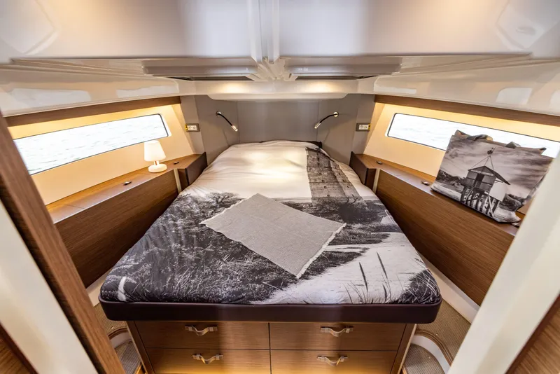 Slide: The Image of Luxurious cabin interior of 2025 Delphia D11 Flybridge yacht with cozy bed and elegant decor. - 11