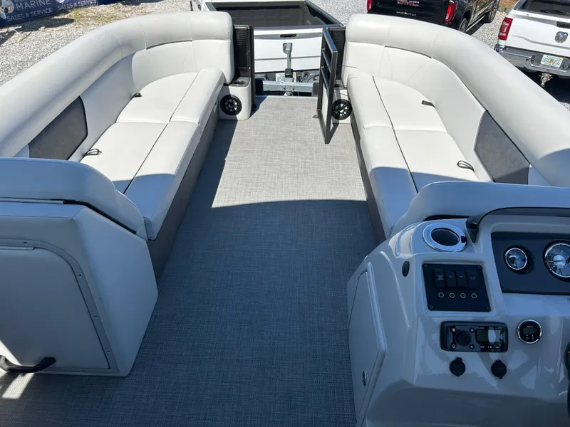 Slide: The Image of 2021 Crest 240 LX SLSC pontoon boat interior with spacious seating and modern dashboard. - 10