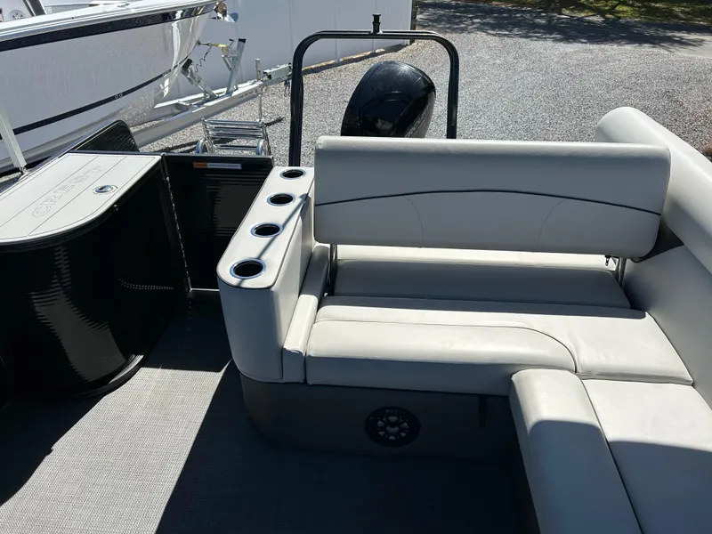 Slide: The Image of 2021 Crest 240 LX SLSC boat interior with seating and cup holders. - 12