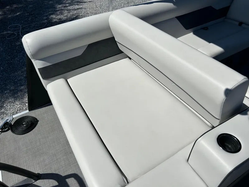 Slide: The Image of 2021 Crest 240 LX SLSC boat interior with gray seating and cup holder. - 14