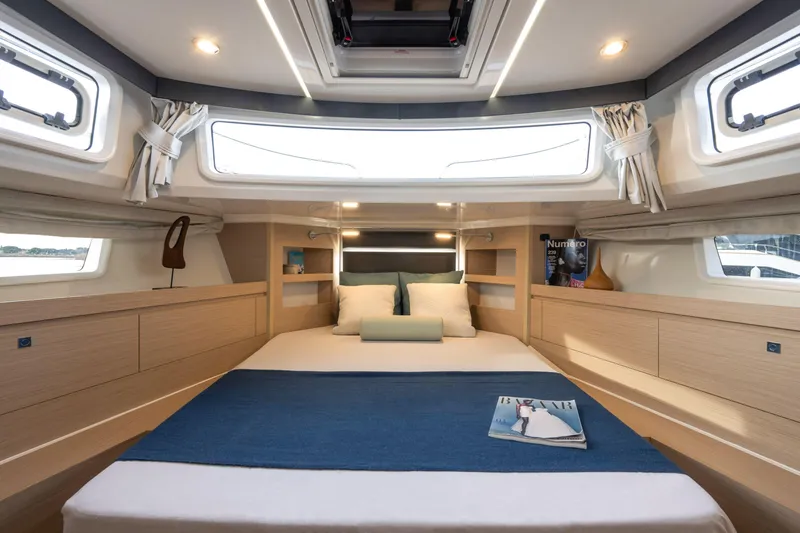 Slide: The Image of Luxurious cabin interior of 2025 Delphia D12 Fly yacht with modern design and cozy bedding. - 6