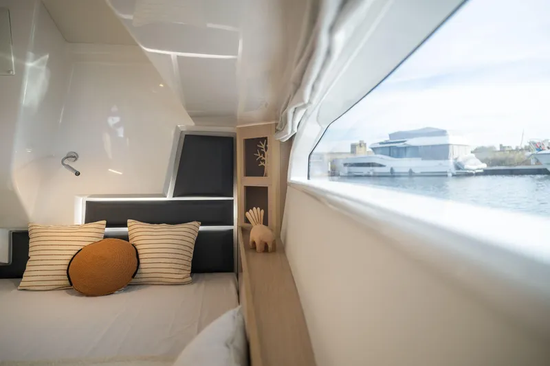 Slide: The Image of Luxurious cabin interior of 2025 Delphia D12 Fly yacht with waterfront view. - 8